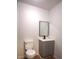 A cozy bathroom showcasing a sleek vanity and toilet, perfect for modern living at 338 Holly Ave, Goose Creek, SC 29445