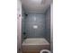 Modern bathroom with blue subway tile and a soaking tub at 338 Holly Ave, Goose Creek, SC 29445