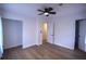 Spacious main bedroom with wood floors, ample closet space, and modern ceiling fan at 338 Holly Ave, Goose Creek, SC 29445
