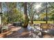 Expansive wooden deck with outdoor seating, perfect for enjoying the serene backyard at 385 Green Winged Teal Rd, Kiawah Island, SC 29455