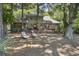 Rear exterior view showcasing the home's expansive deck, ideal for outdoor living and entertainment at 385 Green Winged Teal Rd, Kiawah Island, SC 29455