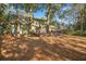 Large backyard featuring a spacious deck, with lots of nature and shade at 385 Green Winged Teal Rd, Kiawah Island, SC 29455