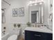 Bathroom with marble countertop, sink, mirror, toilet, and shower at 385 Green Winged Teal Rd, Kiawah Island, SC 29455