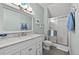 Bathroom featuring marble countertops, a shower, and a large mirror at 385 Green Winged Teal Rd, Kiawah Island, SC 29455