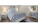 Coastal-themed bedroom showcasing wood floors, soft lighting, and stylish decor at 385 Green Winged Teal Rd, Kiawah Island, SC 29455