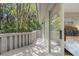 Outdoor deck overlooking lush greenery, providing a serene and private retreat at 385 Green Winged Teal Rd, Kiawah Island, SC 29455