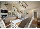 Living room and dining area feature high ceilings with a fan, fireplace, and a wooden dining table at 385 Green Winged Teal Rd, Kiawah Island, SC 29455