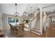 Open dining room boasts views into a living room space and features a staircase leading to the second floor at 385 Green Winged Teal Rd, Kiawah Island, SC 29455