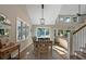 Open dining room features high ceilings with a fan and neutral tones and leads into a living room space at 385 Green Winged Teal Rd, Kiawah Island, SC 29455