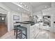 Bright kitchen features an island with barstool seating, stainless steel appliances, and modern finishes at 385 Green Winged Teal Rd, Kiawah Island, SC 29455