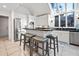 Bright kitchen with an island and seating, stainless steel appliances, and modern finishes at 385 Green Winged Teal Rd, Kiawah Island, SC 29455