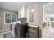Laundry room features a washer, dryer, refrigerator, window, and storage space at 385 Green Winged Teal Rd, Kiawah Island, SC 29455