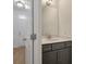 Modern half bath featuring a vanity with a grey cabinet, white countertop, and brushed nickel faucet at 404 Duskywing Dr, Goose Creek, SC 29445