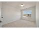 Sunny bedroom with neutral carpeting and a window at 404 Duskywing Dr, Goose Creek, SC 29445
