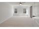 Bedroom featuring carpet, ceiling fan, and two windows at 404 Duskywing Dr, Goose Creek, SC 29445