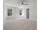 Bedroom featuring carpet, ceiling fan, and two windows at 404 Duskywing Dr, Goose Creek, SC 29445