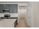 Modern kitchen features grey cabinets, stainless steel appliances, granite countertops and white subway tile backsplash at 404 Duskywing Dr, Goose Creek, SC 29445