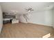 Open living space with hardwood floors, kitchen, and staircase at 404 Duskywing Dr, Goose Creek, SC 29445