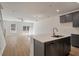 Open-concept living room with hardwood floors and a kitchen island at 404 Duskywing Dr, Goose Creek, SC 29445