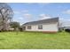 Rear exterior view with a screened porch and well-maintained lawn, showcasing the outdoor space at 412 Hainesworth Dr, Charleston, SC 29414