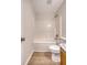 Neutral bathroom with white tile surround, new fixtures and wood-look flooring at 412 Hainesworth Dr, Charleston, SC 29414