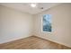 Bright bedroom featuring light wood floors, a ceiling fan and a window at 412 Hainesworth Dr, Charleston, SC 29414