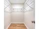 Walk-in closet offering wire shelving and wood-look flooring at 412 Hainesworth Dr, Charleston, SC 29414
