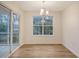 Bright dining room with sliding glass door, window, and hardwood flooring at 412 Hainesworth Dr, Charleston, SC 29414