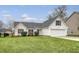 Inviting home with a well-maintained lawn, black shutters, and a two-car garage at 412 Hainesworth Dr, Charleston, SC 29414