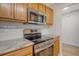 Modern kitchen featuring stainless steel oven, stovetop, microwave and wood cabinets at 412 Hainesworth Dr, Charleston, SC 29414