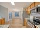 The kitchen features stainless steel appliances and wood cabinets at 412 Hainesworth Dr, Charleston, SC 29414