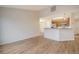 Open-concept living area flowing into the kitchen, with hardwood floors and neutral walls at 412 Hainesworth Dr, Charleston, SC 29414