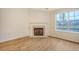 Open living room features a fireplace, large windows, and natural light at 412 Hainesworth Dr, Charleston, SC 29414
