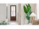 Inviting entryway with a stylish front door, light hardwood floors, and a decorative plant bringing the outdoors inside at 418 Grove End Rd, Moncks Corner, SC 29461