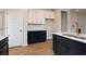 Stylish kitchen featuring two-tone cabinets, modern fixtures, and hardwood floors at 418 Grove End Rd, Moncks Corner, SC 29461