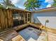 View of the backyard deck attached to the house with screened in porch at 422 Academy Rd, Walterboro, SC 29488