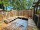 Rustic backyard deck with unique sunken tile feature surrounded by wood framing at 422 Academy Rd, Walterboro, SC 29488