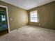 Cozy bedroom with neutral walls and plush carpeting, awaiting personal touches at 422 Academy Rd, Walterboro, SC 29488
