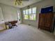 A bedroom that features carpet and a big window with a dresser next to it at 422 Academy Rd, Walterboro, SC 29488