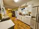 Bright kitchen with wood flooring, white cabinetry, and modern appliances for cooking and convenience at 422 Academy Rd, Walterboro, SC 29488