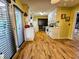 View of the kitchen with wood floors, cabinetry, modern appliances, and bright natural light at 422 Academy Rd, Walterboro, SC 29488