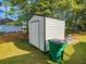 Backyard shed for storage with green trash receptacle at 422 Academy Rd, Walterboro, SC 29488