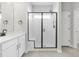 Modern bathroom with a glass shower, built-in seat, and sleek, black hardware at 4316 Cotton Flat Rd, Summerville, SC 29485