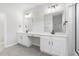 Bathroom with dual vanities, a built-in makeup table, and modern light fixtures at 4316 Cotton Flat Rd, Summerville, SC 29485