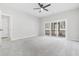 Bright bedroom features sliding glass doors to the outdoor porch and a modern ceiling fan at 4316 Cotton Flat Rd, Summerville, SC 29485