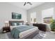 Stylish bedroom with a cozy bed, dark wood furniture, and large windows for natural light at 4316 Cotton Flat Rd, Summerville, SC 29485