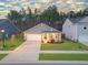 Charming single-story home featuring a well-manicured lawn, inviting front porch, and attached garage at 4316 Cotton Flat Rd, Summerville, SC 29485