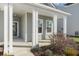 Inviting front porch of home with white pillars and manicured landscaping at 4316 Cotton Flat Rd, Summerville, SC 29485