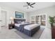 Serene main bedroom with a king bed, ceiling fan, access to a balcony, and neutral decor at 4316 Cotton Flat Rd, Summerville, SC 29485