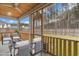 Relaxing screened porch with comfortable seating and a lovely view of the backyard and surrounding landscape at 4316 Cotton Flat Rd, Summerville, SC 29485